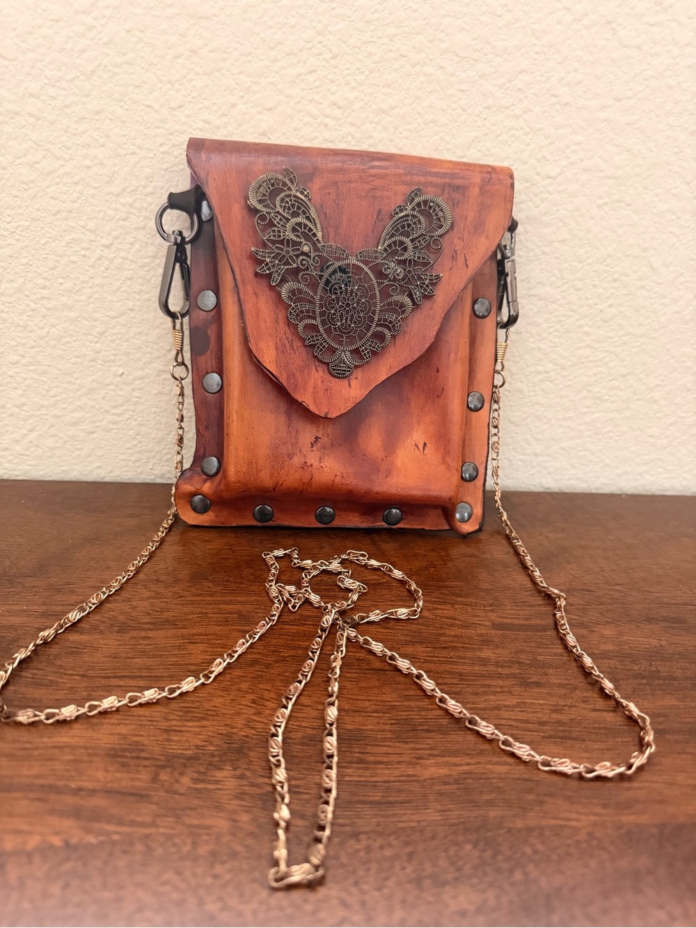 Vintage Brown Leather Crossbody Bag with Filigree Accent